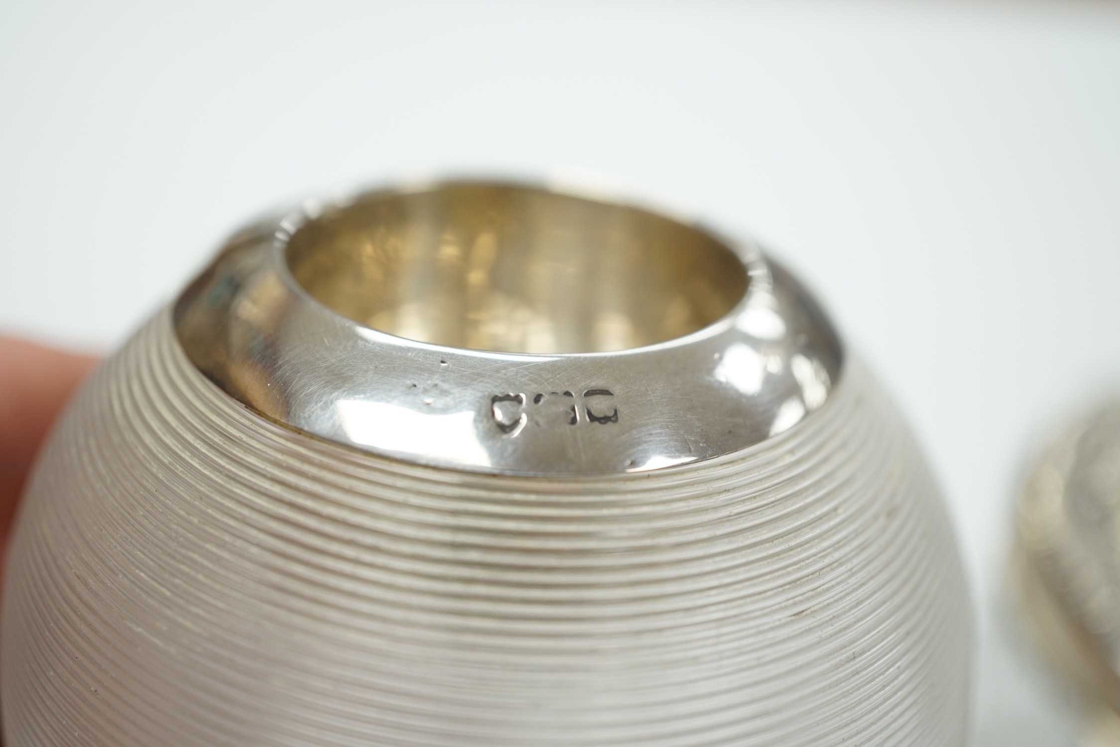 An early 20th century silver mounted ribbed glass match tidy, marks rubbed, height 70mm and a toilet jar